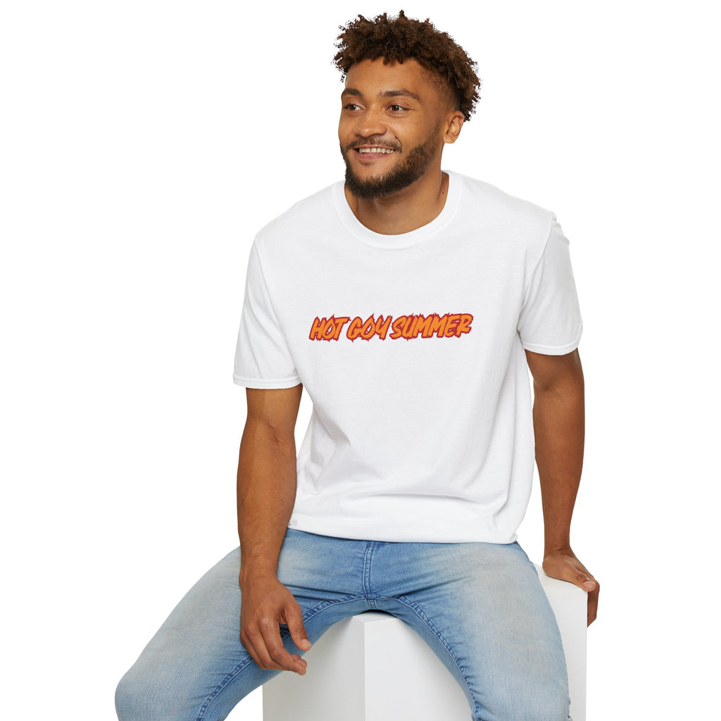 A man wearing a white crewneck t-shirt with 'HOT GAIN SUMMER' printed in orange and yellow across the chest, paired with light blue jeans, sitting on a white block against a white background.