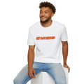 A man wearing a white crewneck t-shirt with 'HOT GAIN SUMMER' printed in orange and yellow across the chest, paired with light blue jeans, sitting on a white block against a white background.