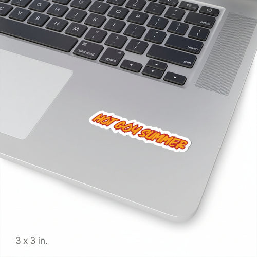 A die-cut vinyl sticker with the text 'HOT GOY SUMMER' in orange and yellow gradient lettering with a white outline, shown applied to the silver palm rest of a laptop keyboard.